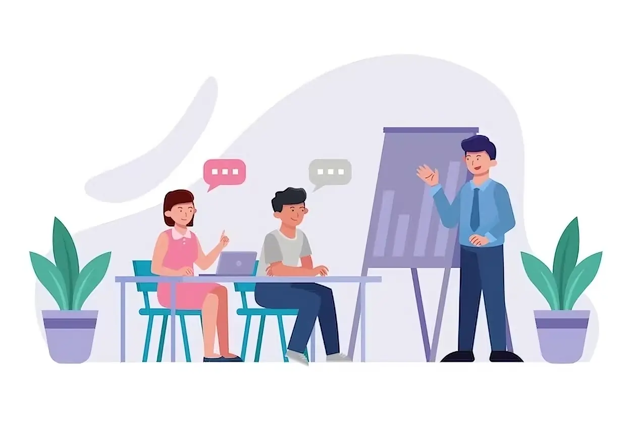 Une équipe suit une formation devant un tableau de présentation